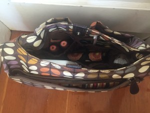 Orla Kiely Baby Changing diaper bag shown open with contents inside