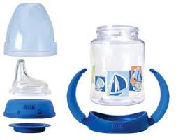 Nuk Learner Cup in 5 ounce size with all the included parts: cover, soft spout, lid, disk for sealing, cup, and removable handles
