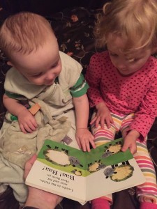 Toddler and infant reading Alphaprints Tweet Tweet book together