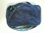 Eagle Creek Pack It Medium Cube filled with kid clothes and shown unzipped