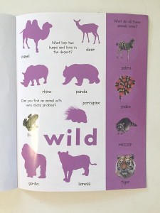 Inside page partially covered with stickers and silhouettes in purple from Animal Sticker Activity book