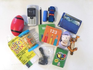 Contents of airplane busy box for young kids
