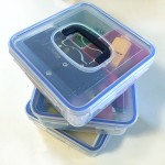 Clear square boxes with locking lids packed with toys for car ride