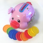 Fisher price laugh and learn piggy bank musical toy pink pig with colored coins