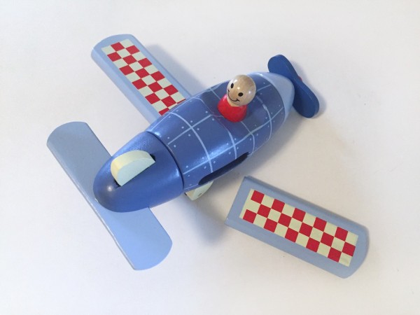 Janod magnetic airplane assembled with one red and white checkered wing detached