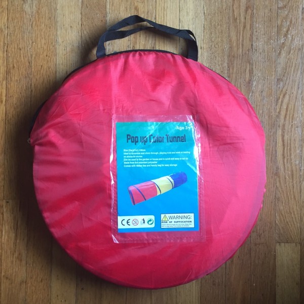 Pop up tunnel inside red storage bag carrying case included with purchase