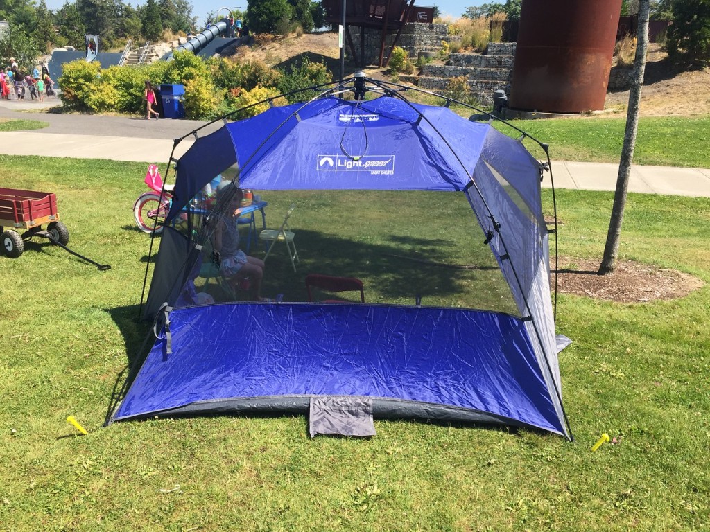 Lightspeed sport shetler pop up shade tent in blue set up in park