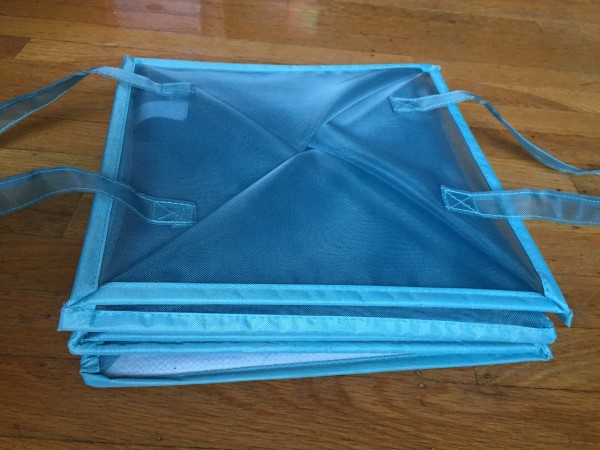 Blue mesh laundry bin tote hamper empty folded flat