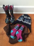 Rain boots, fleece pants, smartwool socks, and winter hat 4T for kids at beach in cold temperatures