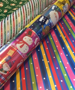 Costco rolls of reversible Christmas and all occasion wrapping paper