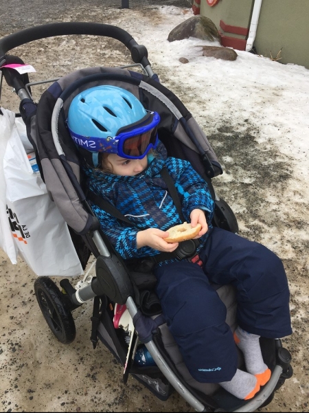 Preschooler wearing Columbia Frosty Slopes snow clothes set while riding in BOB Motion stroller