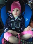 Five year old in rear facing car seat Britax Marathon blue cover