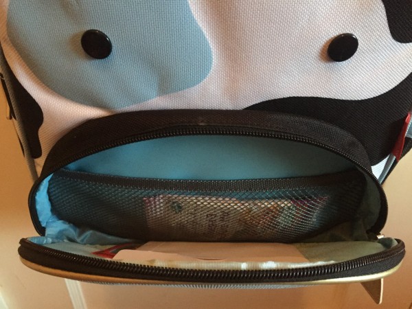 Cow backpack front pocket open with mesh pocket visible inside on Skip Hop cow little kids backpack