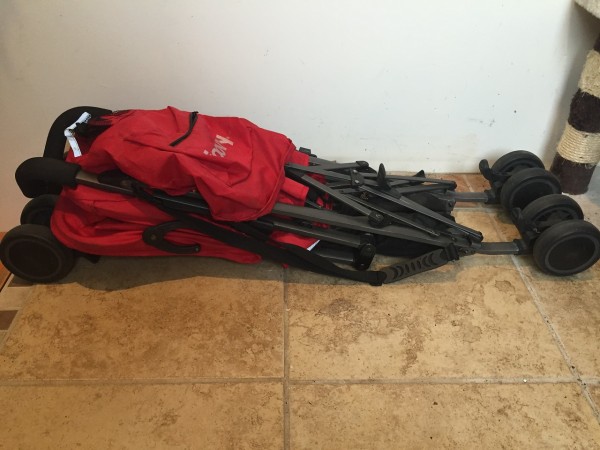 Joovy ultralight Groove umbrella stroller in red folded on floor