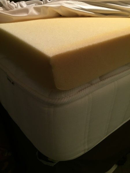Four inch foam bed topper on top of mattress
