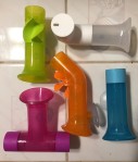 Boon Building Bath Pipes set of five water toy pipes with suction cups in pink, blue, orange, green, and white