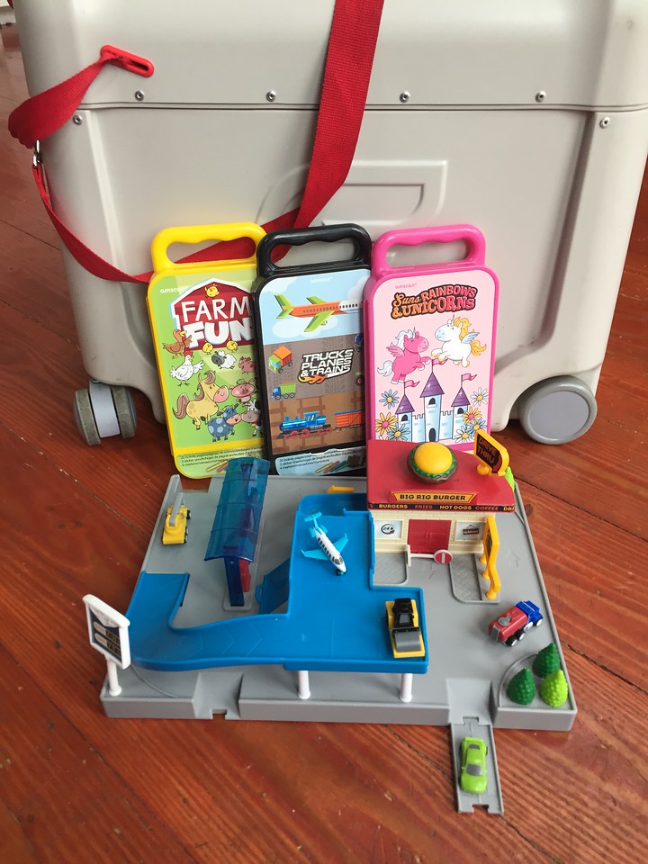 JetKids BedBox with three Amscan travel coloring kits and Driven pocket series restaurant service station play set