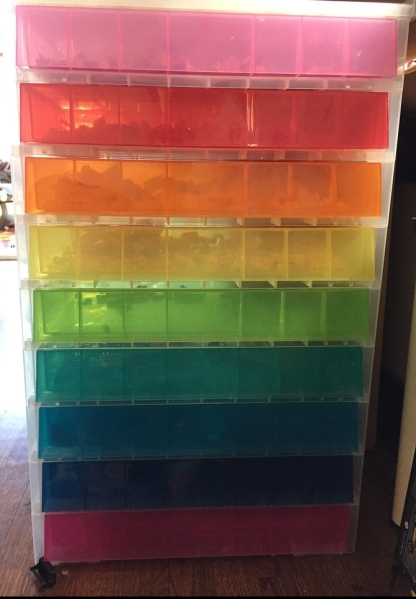 Nine Rainbow drawer storage unit filled with Lego pieces