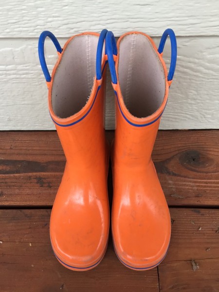 Norty Rain boots for kids in orange print with bright blue trim and handles