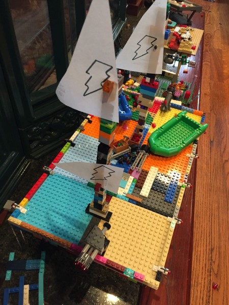 Lego pirate ship with paper sails built without set or instructions by nine and seven year olds