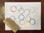 Circle art project painted with end of toilet paper tube