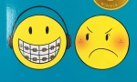 Sisters book cover by Raina Telgemeier close up of smiley face with braces and headphones and angry face