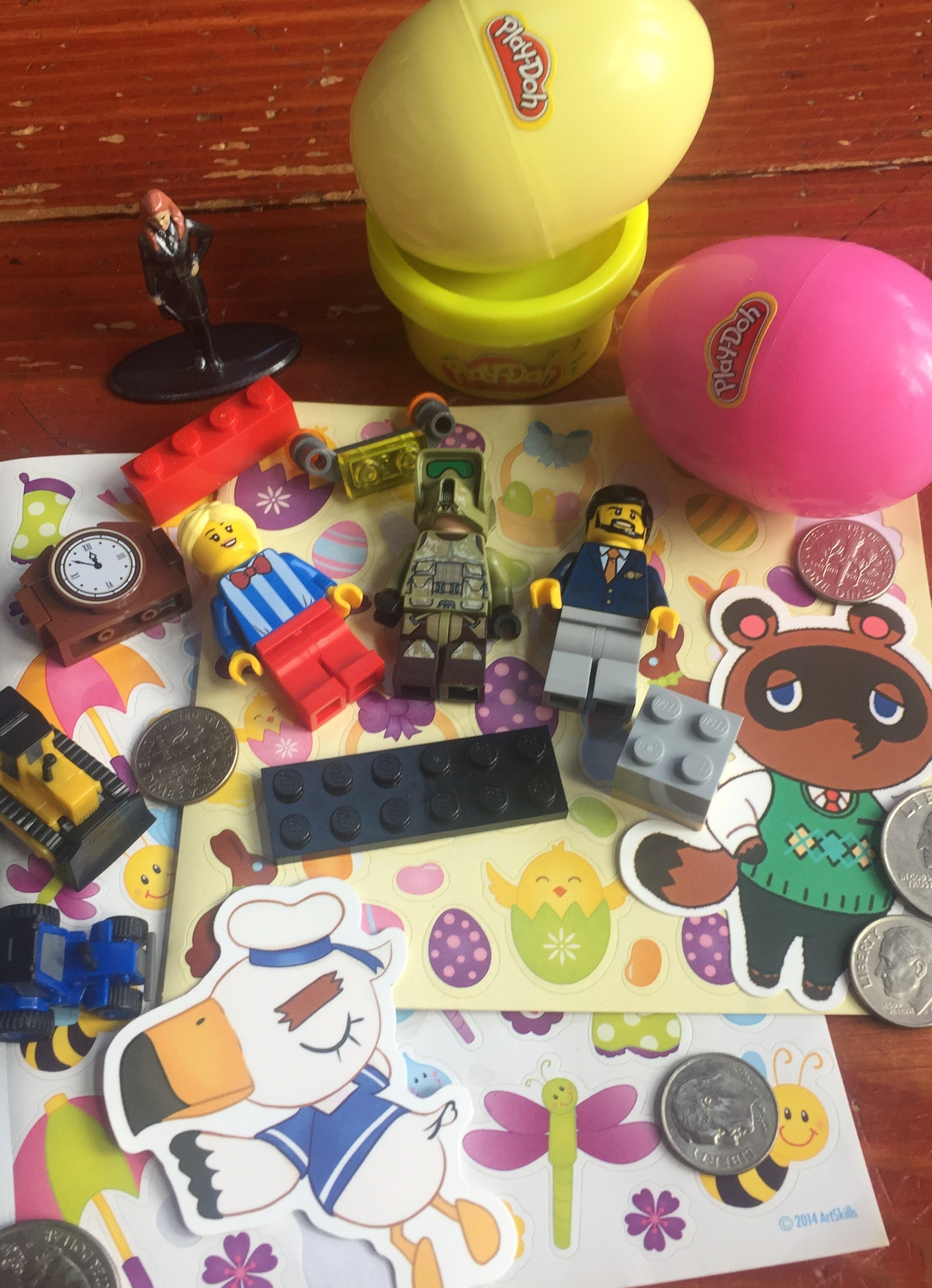 Play-doh Easter eggs Tom Nook Animal Crossing sticker Lego figures and pieces Hermione Grainger Harry Potter miniature figure coins