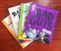 Graphic novels for young readers Bad Guys Unicorn Diaries Bad Kitty Owl Diaries in a stack