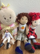 Manhattan Toy Company Baby Stella doll, two Groovy Girls dolls one boy and one girl, and one Lottie Doll sitting together in pile