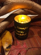 Happy Thanksgiving candle inside holder with grateful family thankful printed on outside