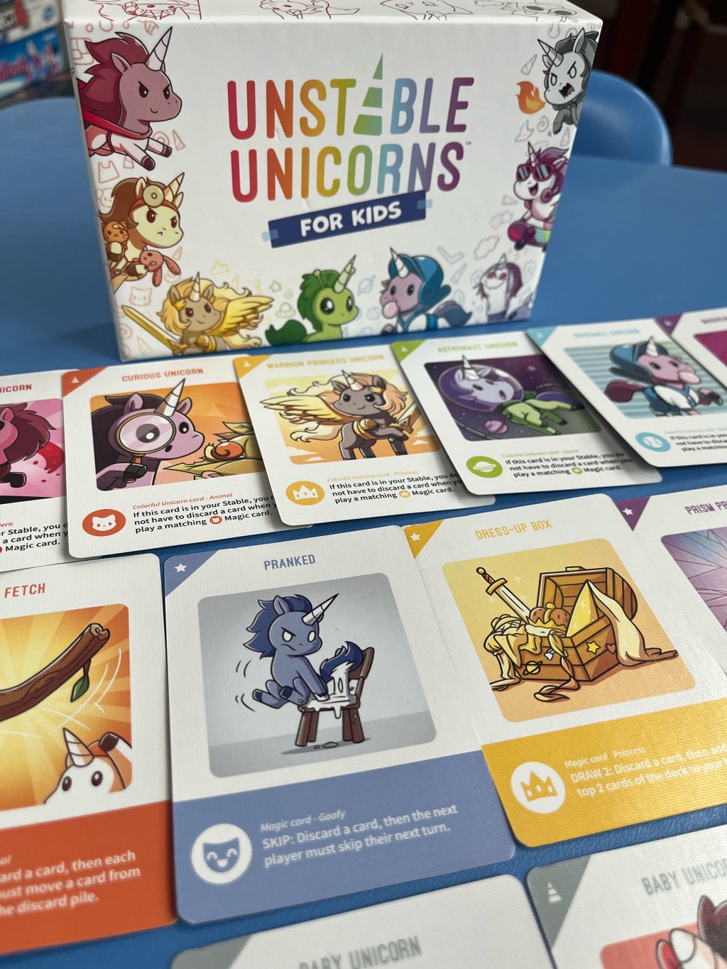 Unstable Unicorns For Kids edition cards laid out on table