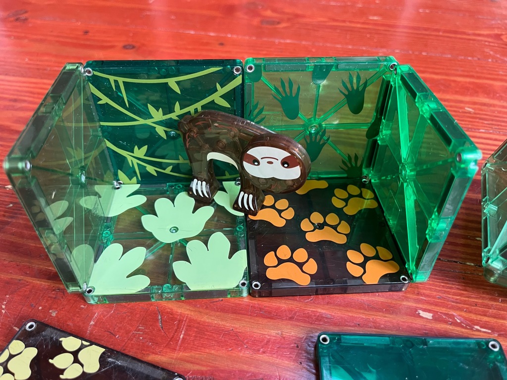 Jungle themed Magna-Tiles set with sloth against printed background magnetic tile toys