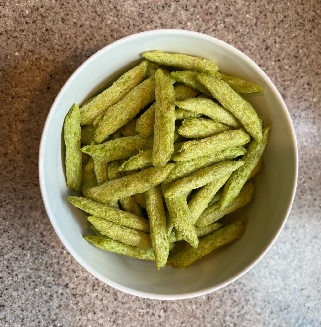 Calbee Harvest Snaps Green Pea Crisps lightly salted flavor in. bowl