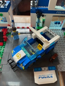 LEGO City Police Station Set 60316 police car with removable roof to access driver's seat and roof that rotates to open jail in back