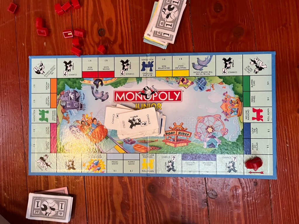 Monopoly Junior board game set up on hardwood floor